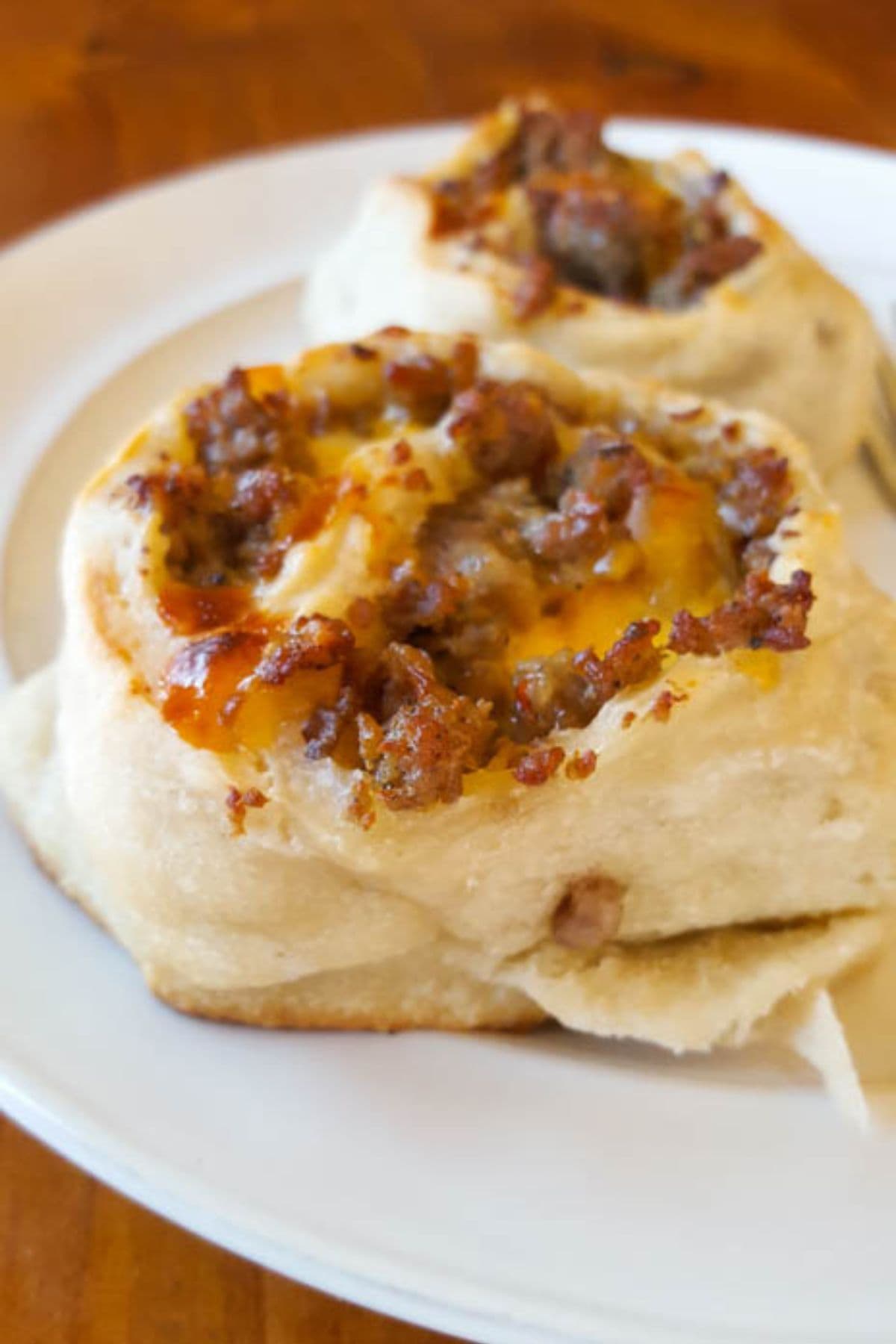 Sausage breakfast pinwheel on a plate.