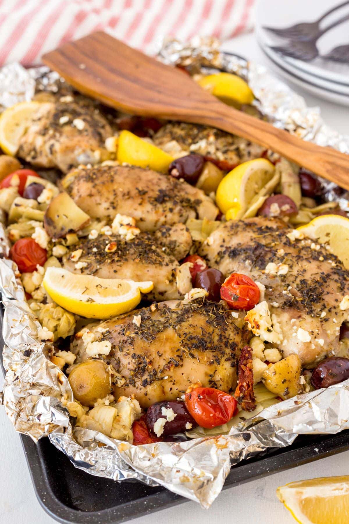 Chicken and vegetables in baking dish.