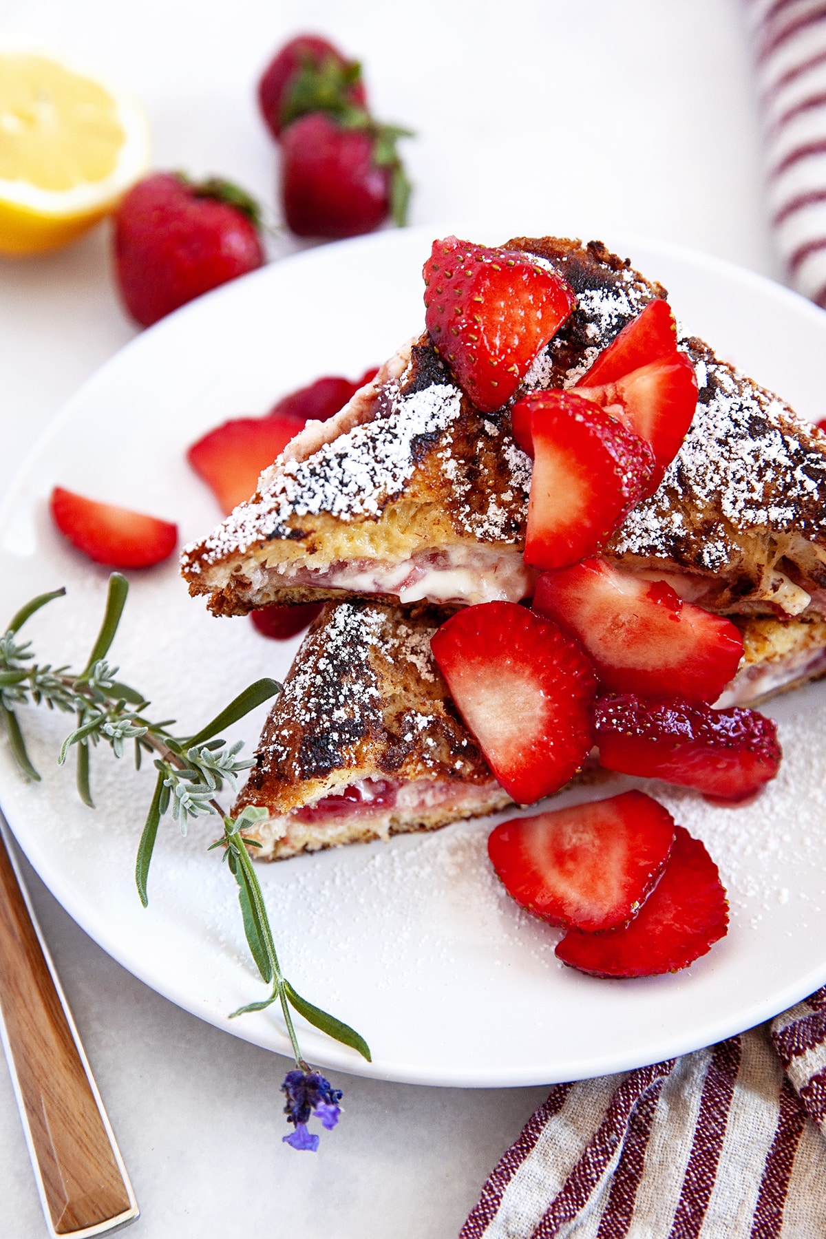Stuffed French Toast with strawberries on a white plate. 